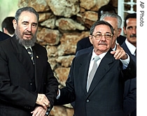 Cuban President Fidel Castro, left, and his brother Raul Castro, are seen in Havana in this April 13, 2000 