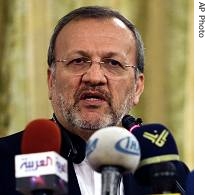 Iranian FM Manouchehr Mottaki, speaks with media during a press conference, in Tehran, Iran, Wednesday, August 16, 2006
