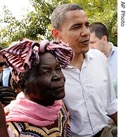 U.S. Senator Barack Obama, right, walks with his grandmother Sarah Hussein Obama at his father's house in Nyongoma Kogelo village, western Kenya, Saturday, Aug. 26, 2006