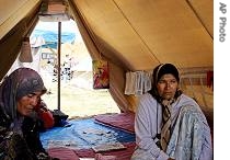 Uzbek women sit in a tent at a bleak refugee camp 40 kilometers (25 miles) from the Uzbek border in Kyrgyzstan (File photo) 