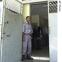 An East Timorese prison guard stands near the door of a prison from which rebel leader Major Alfredo Reinado escaped Wednesday with more than 50 others at the Becora jail Thursday, Aug. 31, 2006 in Dili 
