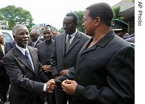 South Africa's President Thabo Mbeki, left, shakes hands with Tanzania's President Jakaya Kikwete at a summit in Dar Es Salaam Sunday, June 18, 2006 