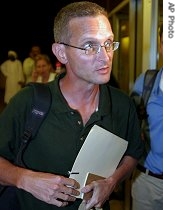 American journalist Paul Salopek leaves a press conference in Khartoum, Sudan