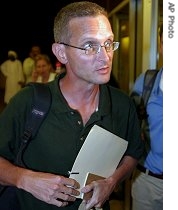 American journalist Paul Salopek leaves a press conference in Khartoum, Sudan 