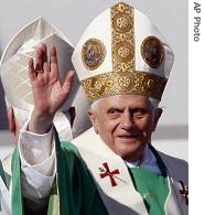 Pope Benedict XVI wavea to pilgrims, Sunday, September 10, 2002