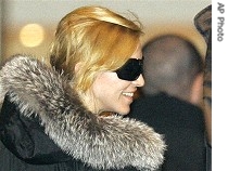 Madonna smiles as she arrives at Moscow hotel Monday, September 11 