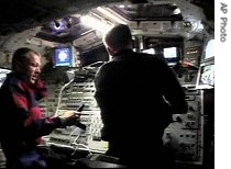 In this image from NASA television, Space Shuttle Atlantis Commander Brent Jett, left, and pilot Chris Ferguson are shown in aft flight deck of shuttle,  Sept. 14, 2006 