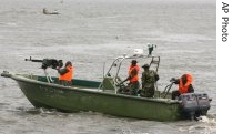 A Nigerian army gunboat arrive at Ikang near Calabar in the Niger Delta area, Aug. 14, 2006 