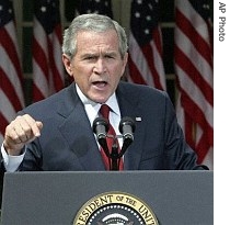 President Bush gestures as he speaks during a press conference in the Rose Garden, Friday, September 15 