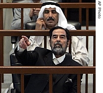 Former Iraqi President, Saddam Hussein argues with the judge as he sits in the court during his trial in Baghdad, Iraq, Monday, Sept. 25, 2006