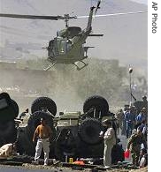 Helicopter carries body of Italian soldier killed after a bomb attack, south of Kabul, September 26, 2006