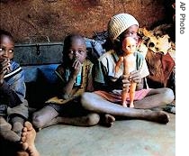 Unidentified children of farm laborers, who faces eviction, inside their home near Messina, South Africa, in February 2005 