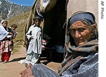 Kashmiri earthquake survivor Kuresha, 73, sits outside her tent in Kalas Chungry