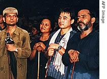 Kamal Dahal, alias Prachanda (R), stands with other leaders Baburam Bhattarai (L), Hishila Yami (2L) and Ram Bahadur Thapa alias Badal (2R) (File photo)
