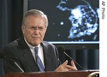 With a map of Korean Peninsula behind him, Donald Rumsfeld gestures during press briefing at Pentagon, Oct. 11, 2006