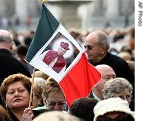 Woman holds a flag bearing photo of Mexiacn Bishop Rafael Guizar Valencia, in St. Peter's square at the Vatican, October 15, 2006  