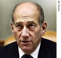 Israeli PM Ehud Olmert is seen at the weekly cabinet meeting at his Jerusalem office, October 15, 2006