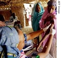 A woman is vaccinated against meningitis in Niger 