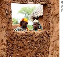 Girls stand outside their home in Todo village, near Ilorin, Nigeria