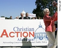 Jane Russell unveils a sign changing the name of The Christian Coalition of Alabama to it's new name, Christian Action Alabama