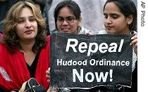 Pakistani human rights activists take part in a protest rally against the Hudood Ordinance or Islamic Rape Law outside the Parliament house in Islamabad, Pakistan on Wednesday, Nov. 15, 2006 