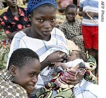 Togolese refugee Asadonde Afi, 17, breastfeeds her baby in Lokossa refugee camp in Benin (file photo)