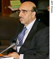 Pakistan's Masood Kahn,  listens to an opening speech delivered by Japanese Senior Vice FM Katsutoshi Kaneda for the BWC seminar in Tokyo (File photo - 14 Feb. 2006)
