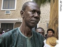Abdourahmane Gueye, left, seen at court in Dakar, Nov. 25, 2005