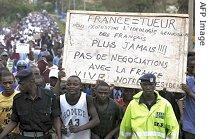 Rwandans demonstrate in the streets of Kigali over arrest warrants issued by French Judge Jean-Louis Bruguiere, 23 Nov. 2006