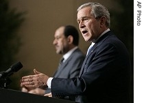 President George W. Bush answers reporter's question during joint press conference with Iraqi Prime Minister Nouri al-Maliki in Amman, 30 Nov. 2005