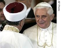 Pope Benedict XVI (r) is welcomed by Mufti of Istanbul Mustafa Cagrici,  at the Blue Mosque