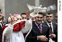 Pope Benedict XVI frees a dove upon his arrival at Istanbul's Holy Spirit Cathedral, 1 Dec. 2006