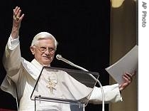Pope Benedict XVI gestures from his study window overlooking St. Peter's Square, 3 Dec 2006