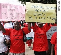 Kenyan women hold posters during a protest march in Nairobi, Kenya