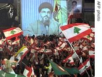 Hezbollah leader Hassan Nasrallah addresses supporters on giant screen in downtown Beirut 7 Dec 06