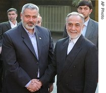 Palestinian Prime Minister Ismail Haniyeh, left, and Iranian Vice-President Parviz Davoudi, in Tehran, 8 Dec. 06<br /><br />