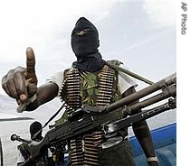 Militants wearing black masks, military fatigues and carrying Kalashnikov assault rifles and rocket-propelled grenade launchers patrol the creeks of the Niger Delta area of Nigeria (File)