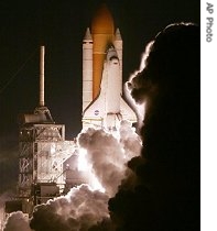 Space Shuttle Discovery lifts off with a crew of seven at the Kennedy Space Center, Florida