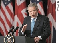 George W. Bush answers reporter's question during joint press conference with British PM Tony Blair, 7 Dec. 2006