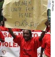 Kenyan woman holds a poster during a protest march in Nairobi, Kenya, 7 Dec 2006