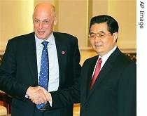 Henry Paulson left, is greeted by Chinese President Hu Jintao after closing of Strategic Economic Dialogue, 15 Dec. 2006