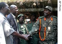 Joseph Kony, leader of LRA (right)with Ugandan delegation near Sudanese border, 31 Jul 31 2006 