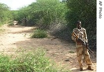 A Somali government soldier guards a path in Moode Moode a town nine miles from the government garrison town of Baidoai, Dec 22, 2006<br /><br />