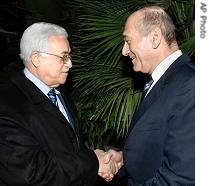Israeli PM Ehud Olmert, right, Palestinian Authority President Mahmoud Abbas, at Olmert's official residence in Jerusalem, 23 Dec 2006