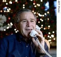 President George W. Bush makes Christmas Eve telephones calls to members of the Armed Forces from Camp David, Maryland