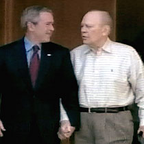 Former President Gerald Ford walking with President George W Bush