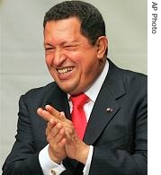 Venezuela's President Hugo Chavez laughs at the swearing ceremony of new ministers in Caracas, 8 Jan 2007