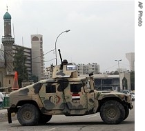 An Iraqi army Humvee blocks a street in central Baghdad, Iraq
