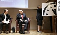 Kennette Benedict, right, executive director of Bulletin of the Atomic Scientist, along with Lawrence Krauss, left, and Ambassador Thomas Pickering, unveils the 'Doomsday Clock'