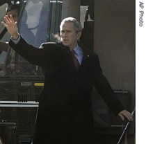 President Bush waves as he boards Marine One to travel to Camp David